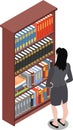 Woman looking on books in bookshelf in library
